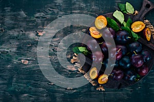 Fresh plums with leaves. Fruits.