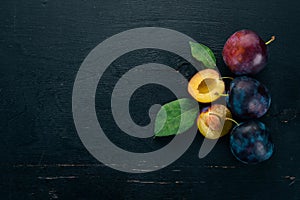 Fresh plums with leaves. Fruits.