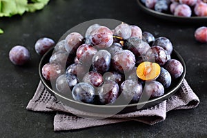 Fresh plums on plate