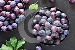 Fresh plums on plate