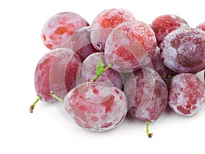 Fresh plums with water drops.