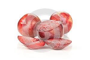 Fresh pluot interspecific plums isolated on white