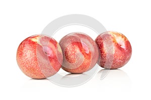 Fresh pluot interspecific plums isolated on white