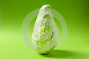 Fresh pointed cabbage on color background