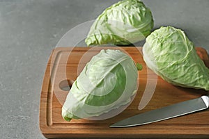 Fresh pointed cabbage on wooden board