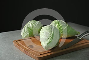 Fresh pointed cabbage on wooden board
