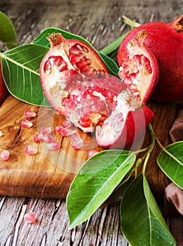 Fresh pomegranates and juice, selective focus