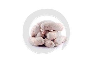 Fresh pork meat wrapped in guts, homemade raw sausages on a white background , isolated