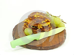 Fresh potatoe pancake on wooden plate