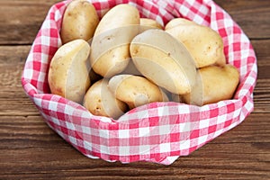 Fresh potatoes in a towel