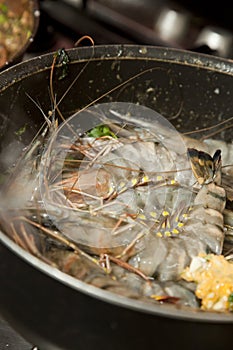 Fresh prawn being cooked in a pan