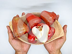 Fresh premiun quality rose apple or Syzygium samarangense with wooden bowl  on white background. Also known as wax apple,