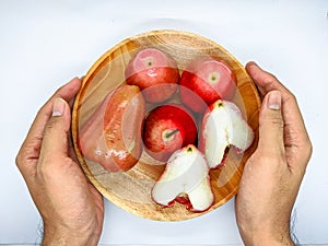 Fresh premiun quality rose apple or Syzygium samarangense with wooden bowl  on white background. Also known as wax apple,