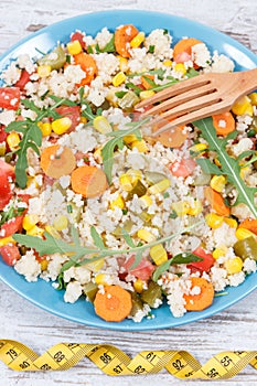 Fresh prepared salad with couscous and vegetables. Light dietary vegan meal for slimming