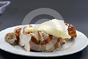 Fresh pretzel with cheese is a tasty snack