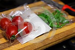 fresh products prepacked for salad. Tomatoes, sour cream, arugula.