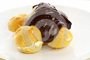 Fresh profiteroles with hot chocolate sauce