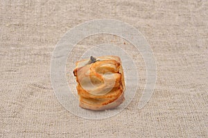 Fresh puff pastry with mushrooms on jute background. Vegetarian