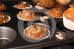 Fresh pumpkin muffins in baking form