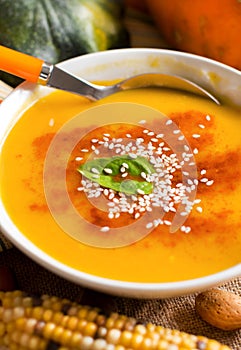 Fresh pumpkin soup with a spoon