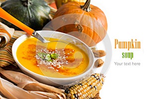 Fresh pumpkin soup with a spoon