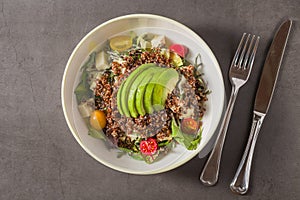 Fresh quinoa salad with avocado, cherry tomato and mixed greens