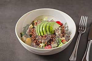 Fresh quinoa salad with avocado, cherry tomato and mixed greens