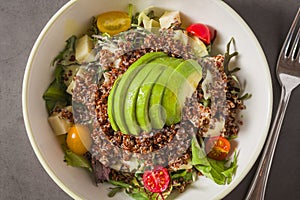 Fresh quinoa salad with avocado, cherry tomato and mixed greens