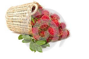 Fresh rambutan with leaf on the basket