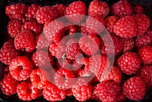 Fresh raspberries as background