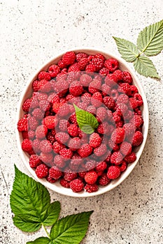 Fresh raspberries in bowl. Ripe juicy fresh raspberries