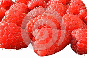 Fresh raspberries close-up on a white background, front view, isolators