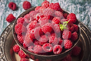 Fresh raspberries in vintage basket, vitamins, healthy food, ve