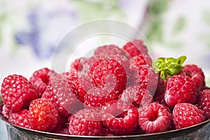 Fresh raspberries in vintage basket, vitamins, healthy food, ve