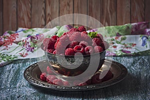 Fresh raspberries in vintage basket, vitamins, healthy food, ve