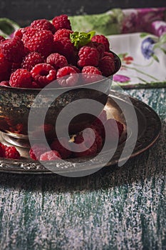 Fresh raspberries in vintage basket, vitamins, healthy food, ve