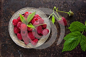 Delicious Fresh raspberries in vintage basket vitamins healthy food vegan ingredients. Selective focus