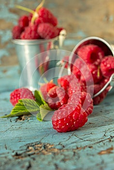 Fresh raspberries in vintage basket vitamins healthy food vegan ingredients. Selective focus