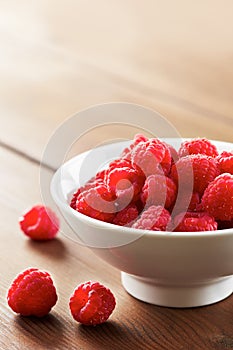 Fresh raspberries in white bowl