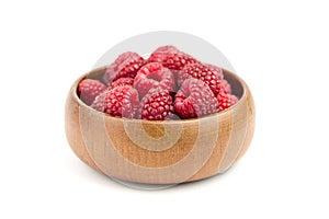 Fresh raspberries in wooden bowl isolated on white background. Red sweet raspberries