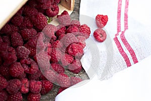 Fresh raspberries on a wooden table.