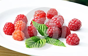 Fresh raspberry fruits on white background