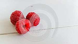 Fresh raspberry on wooden table