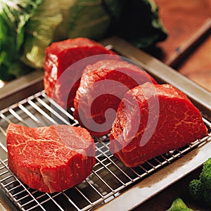 Fresh raw beef on kitchen table