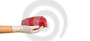 Fresh raw beef meat slice in gloved hand, isolated on white background. Concept of home delivery or safe shopping