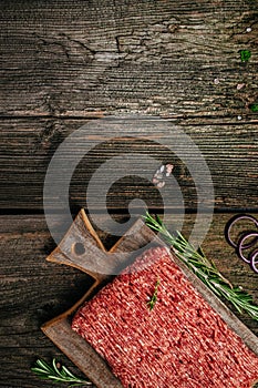 Fresh Raw Beef Minced Meat. Food recipe background. Close up. vertical image. top view. place for text
