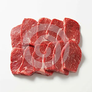 Fresh raw beef pieces arranged elegantly against pristine white background