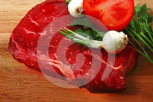 Fresh raw beef steak and vegetables