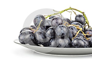 Fresh raw black grape isolated on white