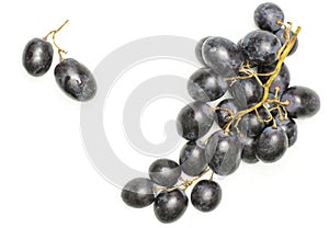 Fresh raw black grape isolated on white
